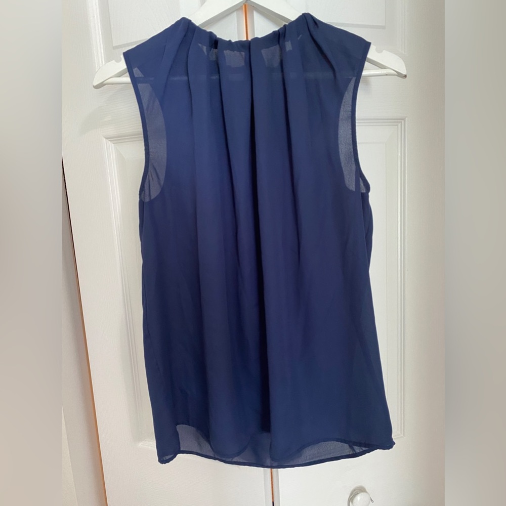 Royal blue sheer top, sleeveless w/ elastic scrunch detail at neck. Size M